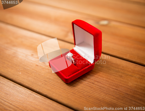 Image of close up of gift box with diamond engagement ring