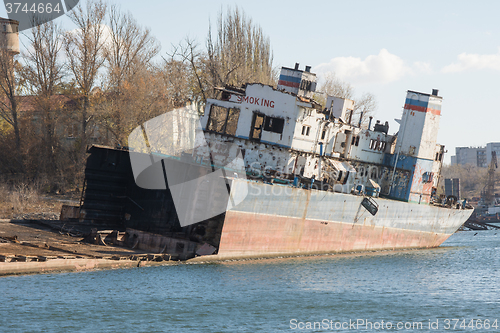 Image of Recycling and dismantling of the ship on the river bank