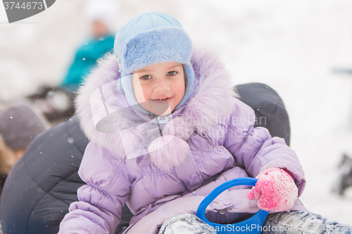 Image of Five-year girl rolled down the hills with the other children