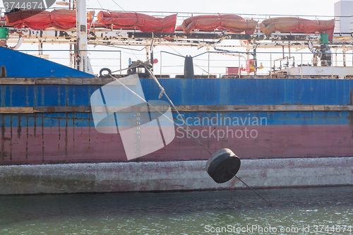 Image of The mooring rope with a cargo vessel loaded