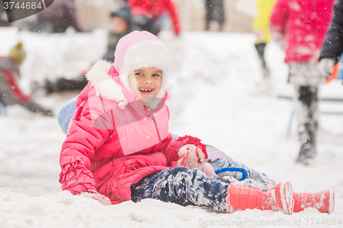 Image of Joyful seven-year child rolled down a hill