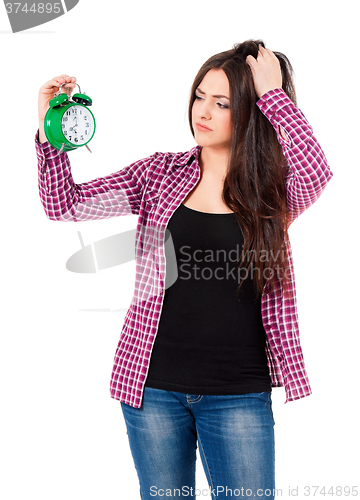 Image of Beautiful girl holding alarm clock