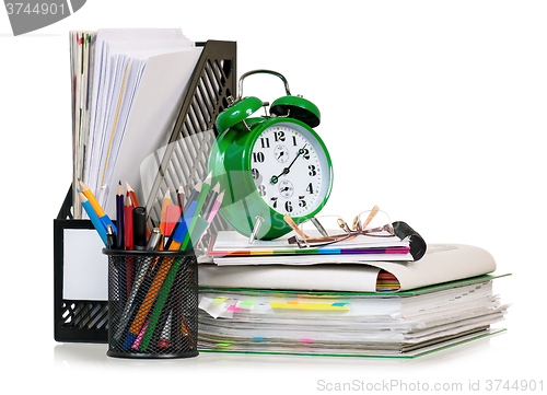 Image of Big green alarm clock with folders