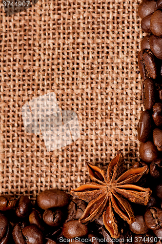 Image of Coffee beans with spices on burlap sack 