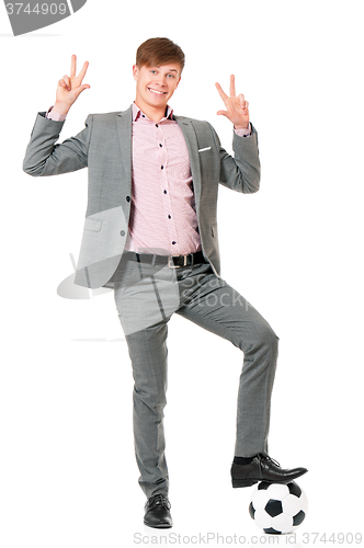 Image of Man in suit with soccer ball