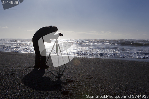 Image of Photographer at black sand beach in Vik, Iceland