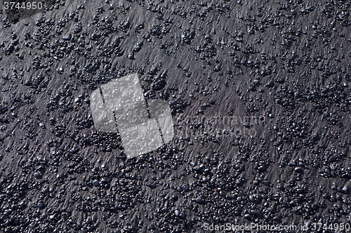 Image of Stone structure at a black sand beach