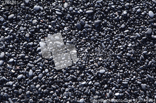 Image of Stone structure at a black sand beach