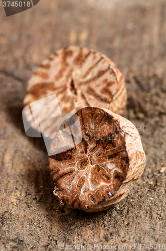 Image of Nutmeg on wooden table