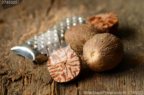 Image of Nutmeg on wooden table