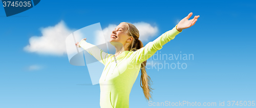 Image of happy sporty woman enjoying sun and freedom
