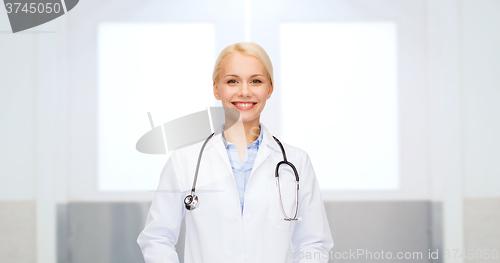 Image of smiling female doctor in white coat