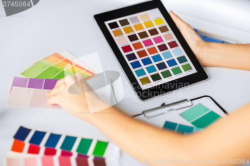 Image of woman working with color samples for selection