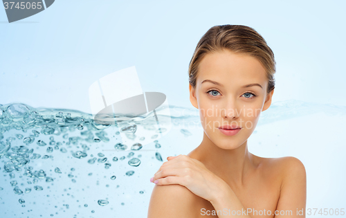 Image of smiling young woman face and shoulders