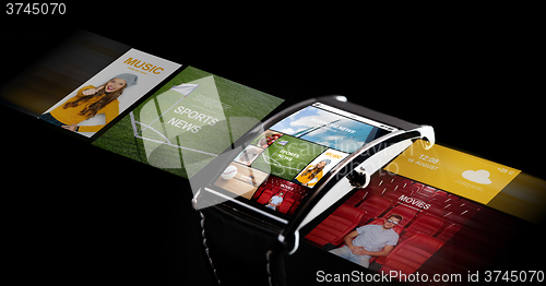 Image of close up of smart watch with media projection