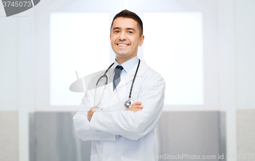 Image of smiling male doctor in white coat