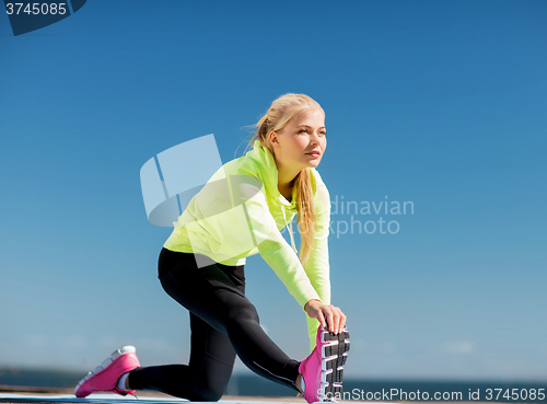 Image of woman doing sports outdoors