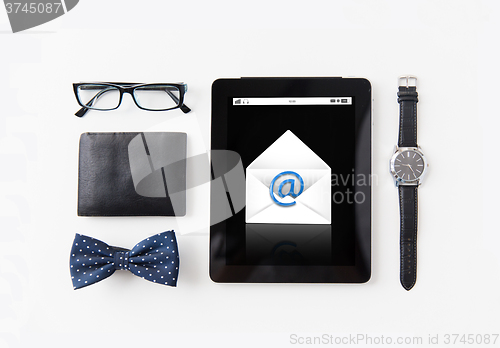 Image of tablet pc with e-male message and personal stuff