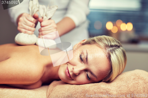 Image of close up of woman lying on massage table in spa