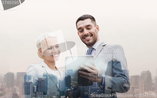 Image of smiling businessmen with tablet pc in city