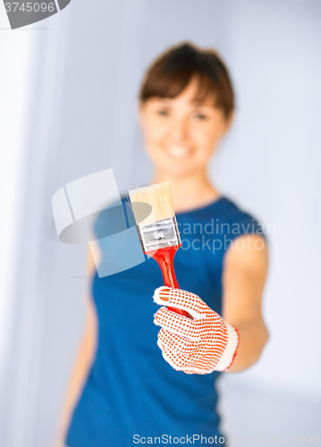 Image of woman with paintbrush