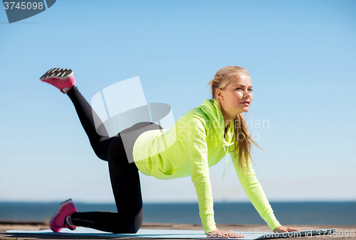 Image of woman doing sports outdoors