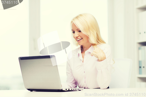 Image of smiling businesswoman or student with laptop