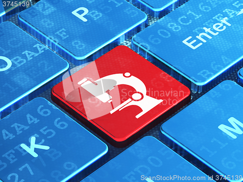 Image of Science concept: Microscope on computer keyboard background