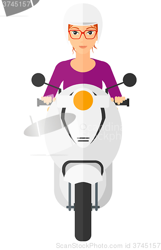 Image of Woman riding scooter.