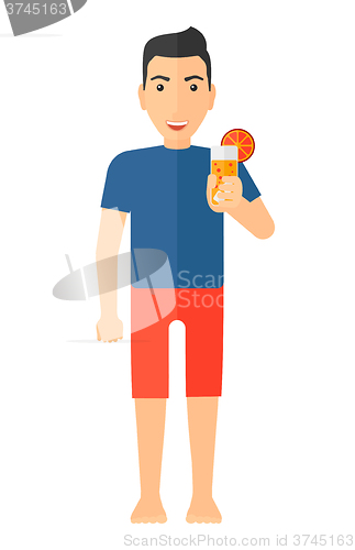Image of Tourist holding cocktail.