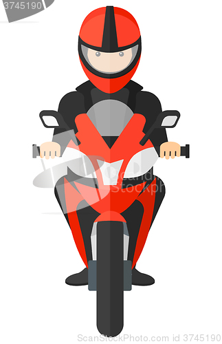 Image of Man riding motorcycle.