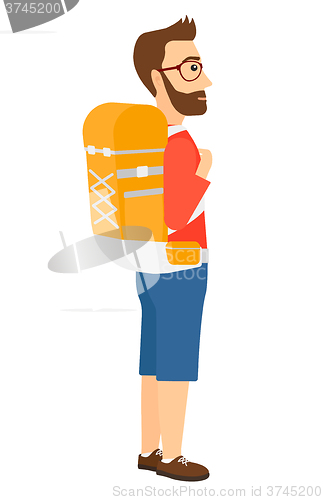 Image of Man with backpack hiking.