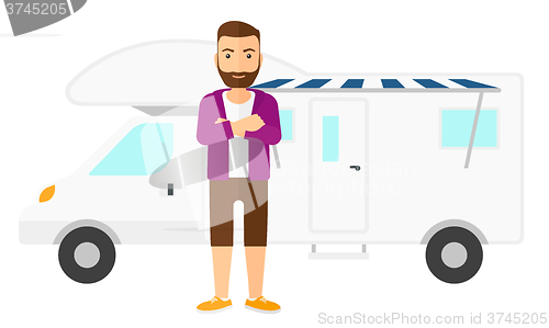 Image of Man standing in front of motor home.