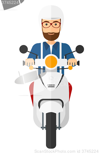 Image of Man riding scooter.