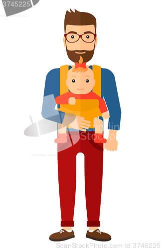 Image of Man holding baby in sling.