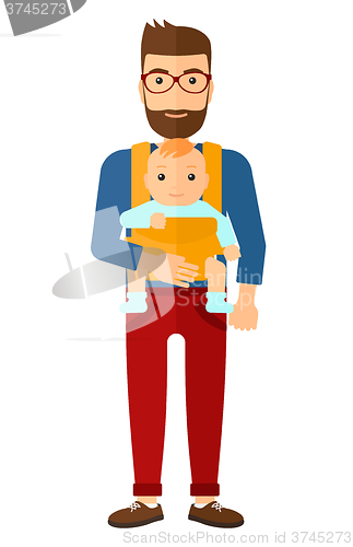 Image of Man holding baby in sling.