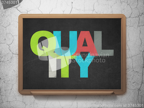 Image of Marketing concept: Quality on School Board background