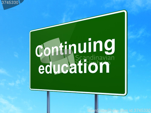 Image of Studying concept: Continuing Education on road sign background