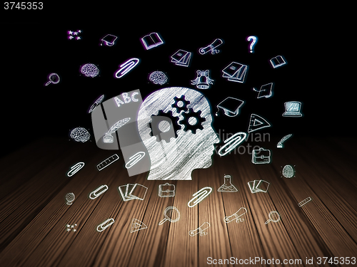 Image of Education concept: Head With Gears in grunge dark room