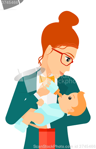 Image of Woman feeding baby.