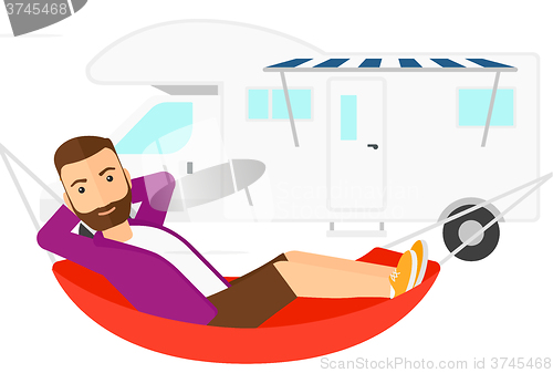 Image of Man lying in hammock.