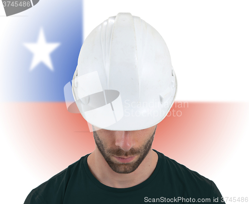 Image of Engineer with flag on background - Chile