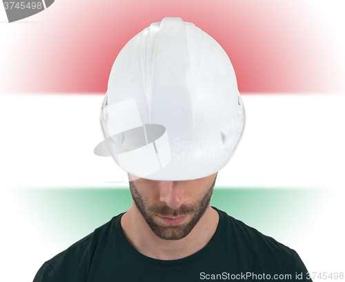 Image of Engineer with flag on background - Hungary