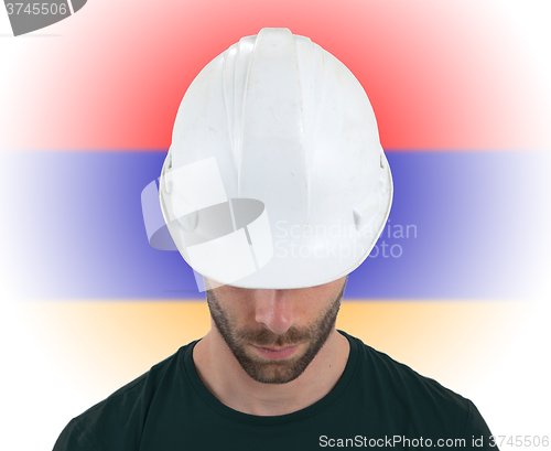 Image of Engineer with flag on background - Armenia