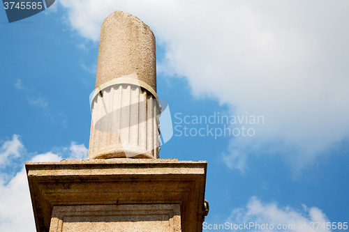 Image of old column in the cloudy sky of europe 