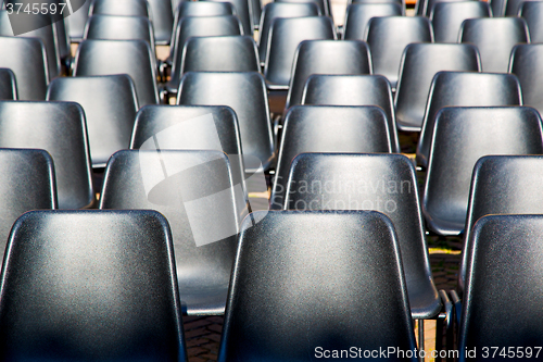 Image of empty seat in black  texture