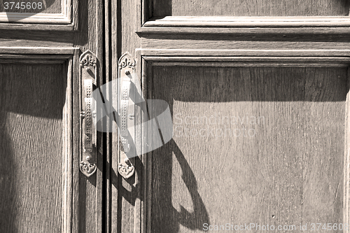 Image of door in italy old ancian wood and trasditional  texture nail