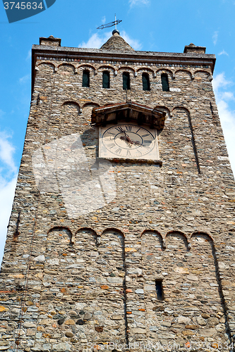 Image of ancien clock tower in italy old  stone and  