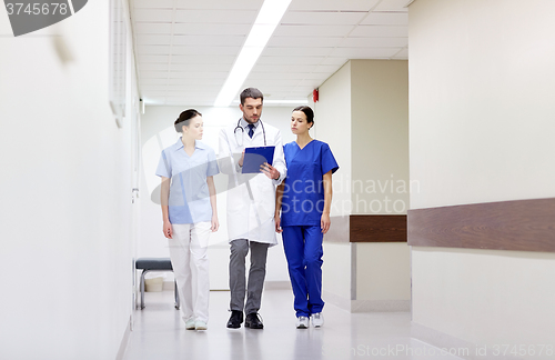 Image of group of medics at hospital with clipboard