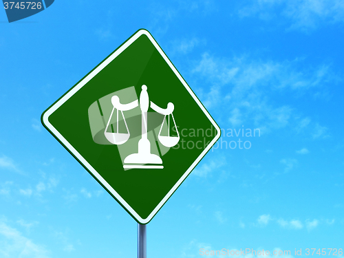 Image of Law concept: Scales on road sign background